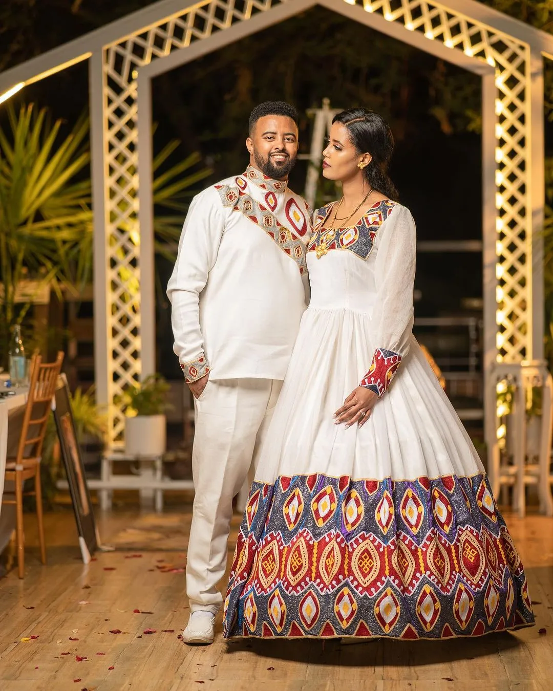 Ethereal Elegance: The Majestic Habesha Wedding Ensemble Habesha Couples Outfit