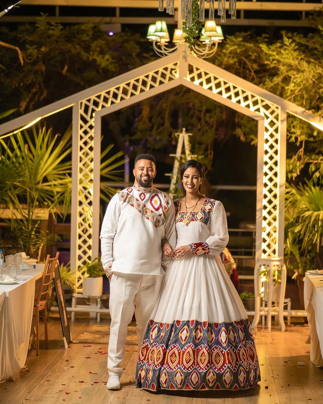 Ethereal Elegance: The Majestic Habesha Wedding Ensemble Habesha Couples Outfit