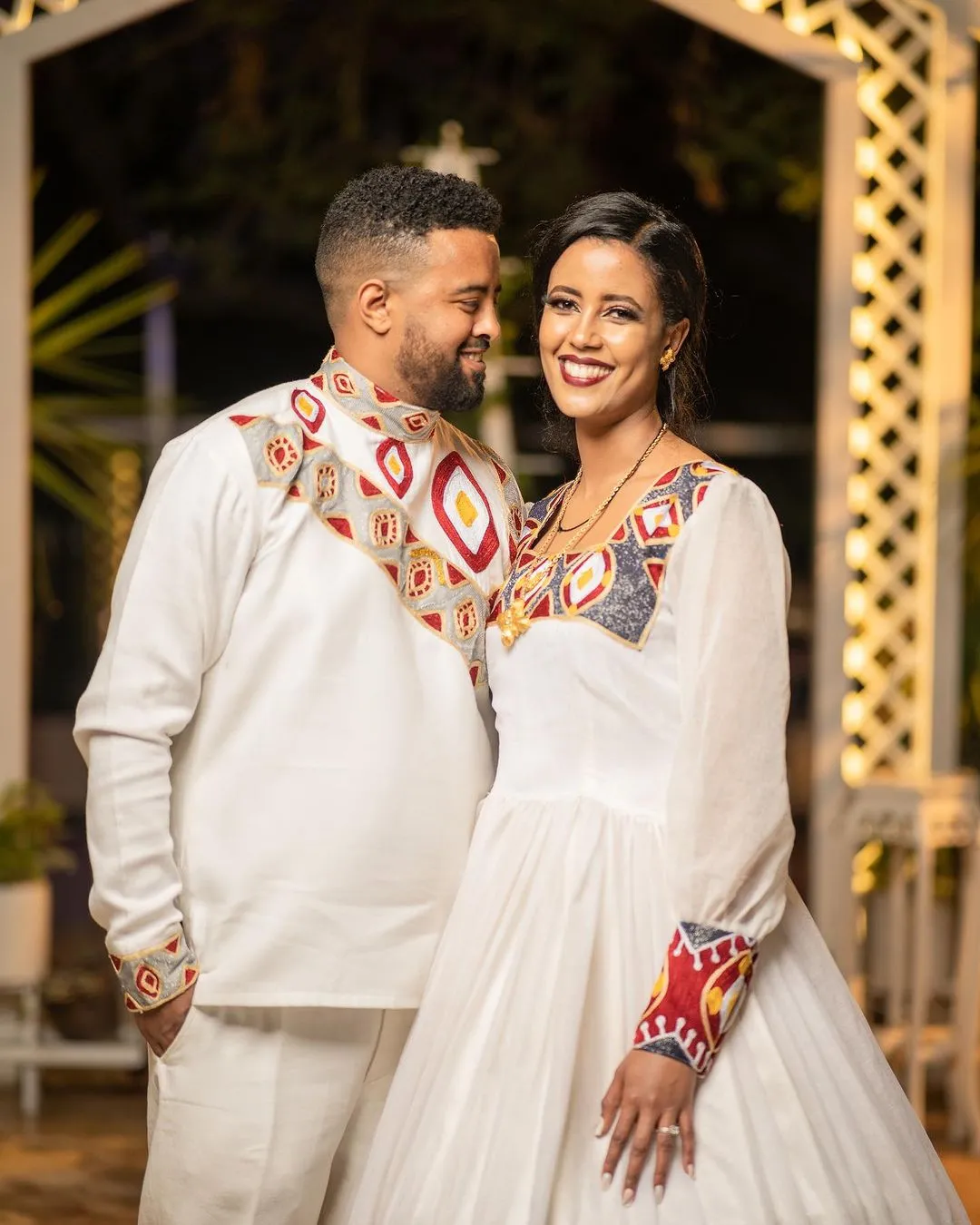 Ethereal Elegance: The Majestic Habesha Wedding Ensemble Habesha Couples Outfit